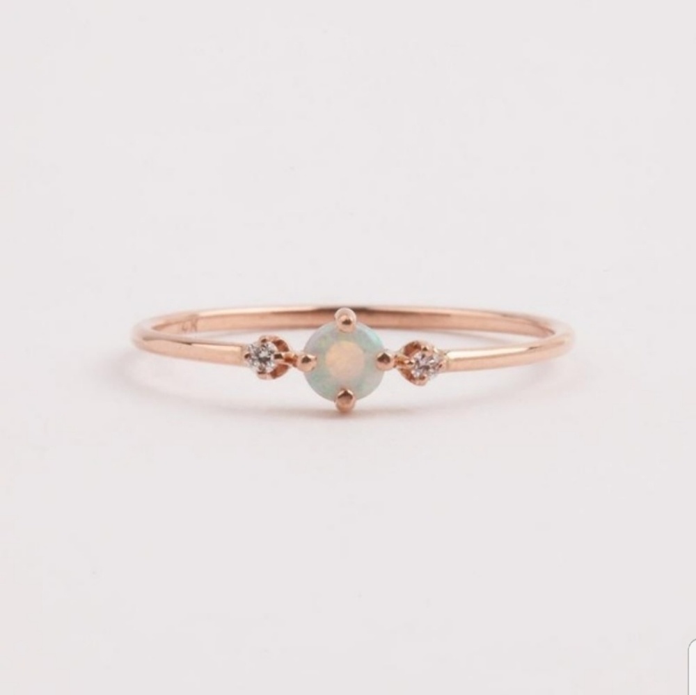 Rose gold colored fire opal ring